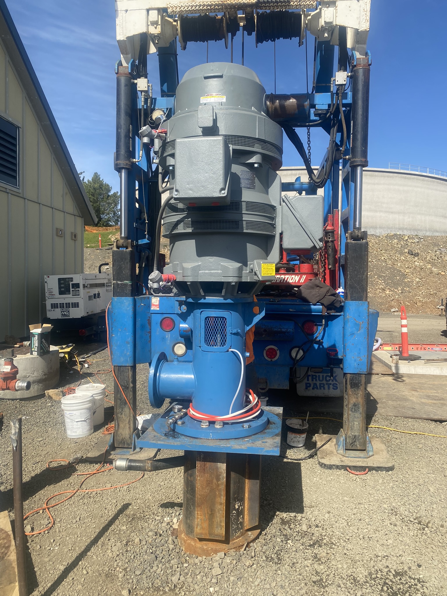 Schneider Water Services pumps and water systems Schneider Water Services pumps and water system device on a gravel patch